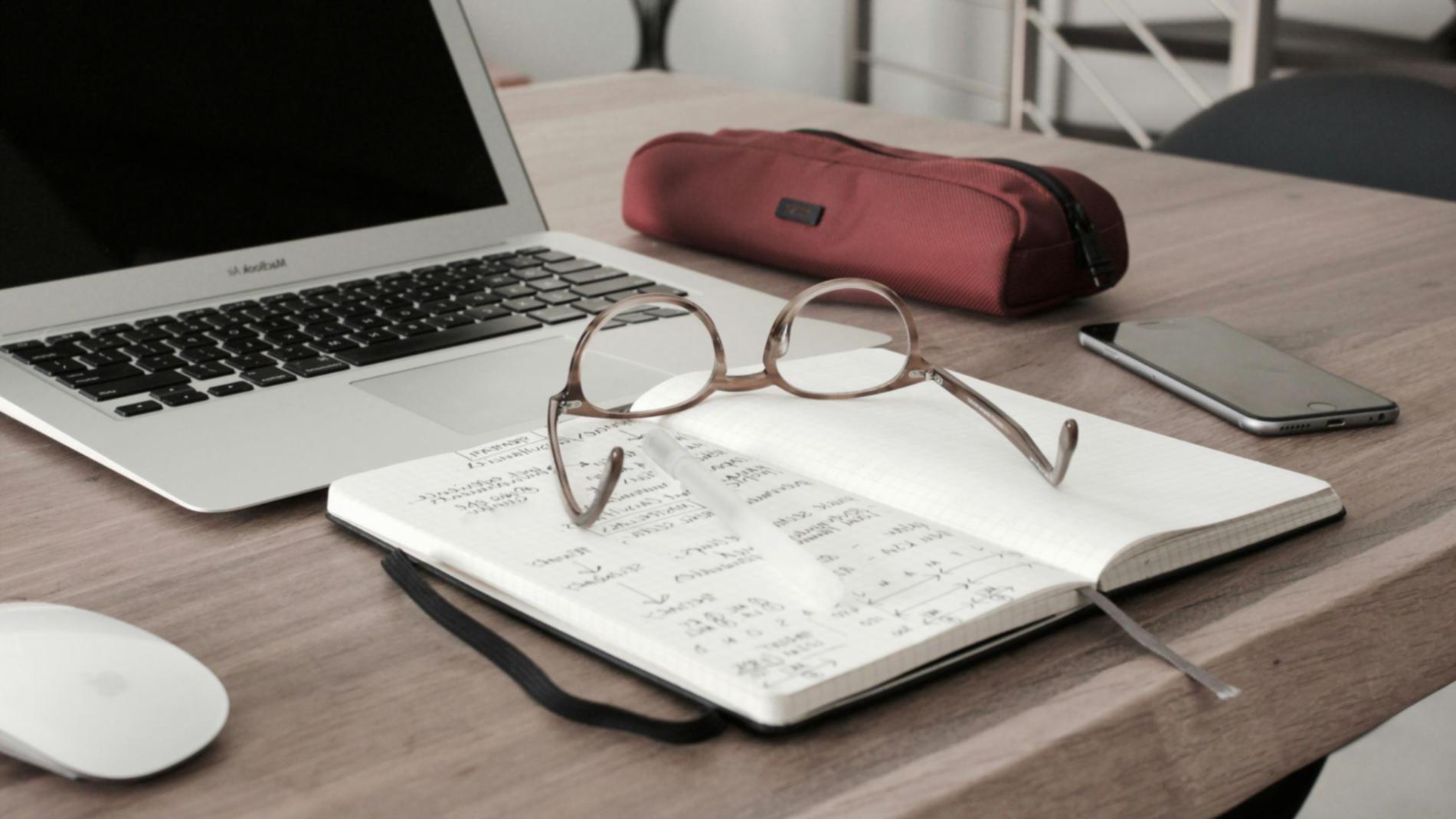 Person reviewing financial documents and budget plans